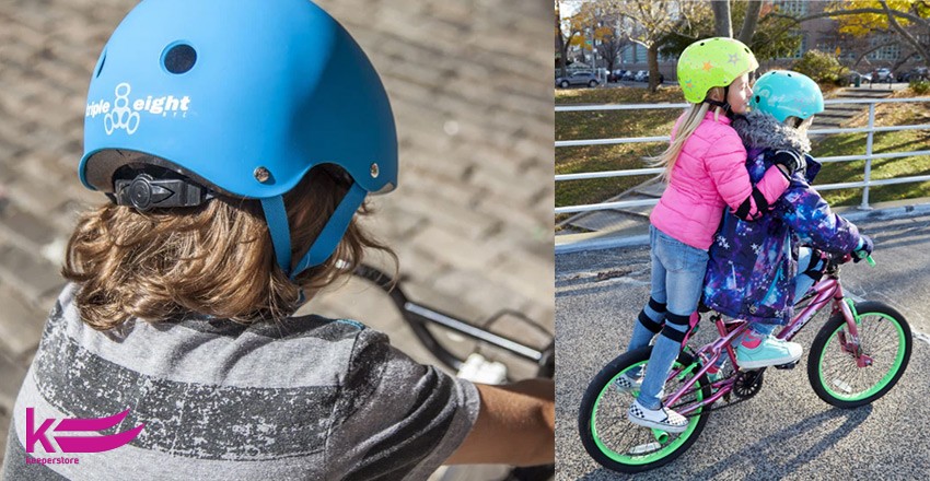 Діти катаються на велосипеді в захисних шоломах